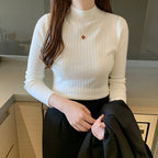 Elvara | Maglione aderente a coste da donna con collo alto