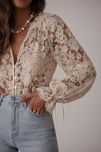 Cream lace blouse detail