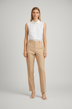 White sleeveless shirt with trousers